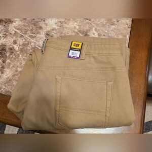 CAT Caterpillar Men's Fleece Lined Canvas Work Pants in tan, size 40x32.
